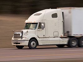 Photo of Class 8 Semi Truck driving at high speed